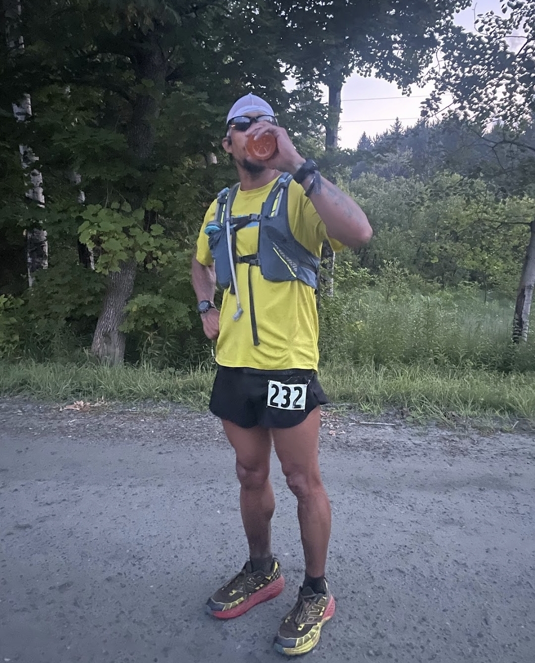 Image of Eric Strong, President of Achilles Charlotte NC Chapter seen staying hydrated.
