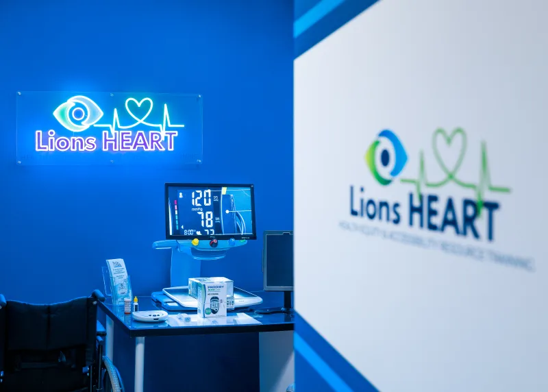 The Lions HEART health, equity, and accessibility resource station with assistive devices and a vital-signs monitor